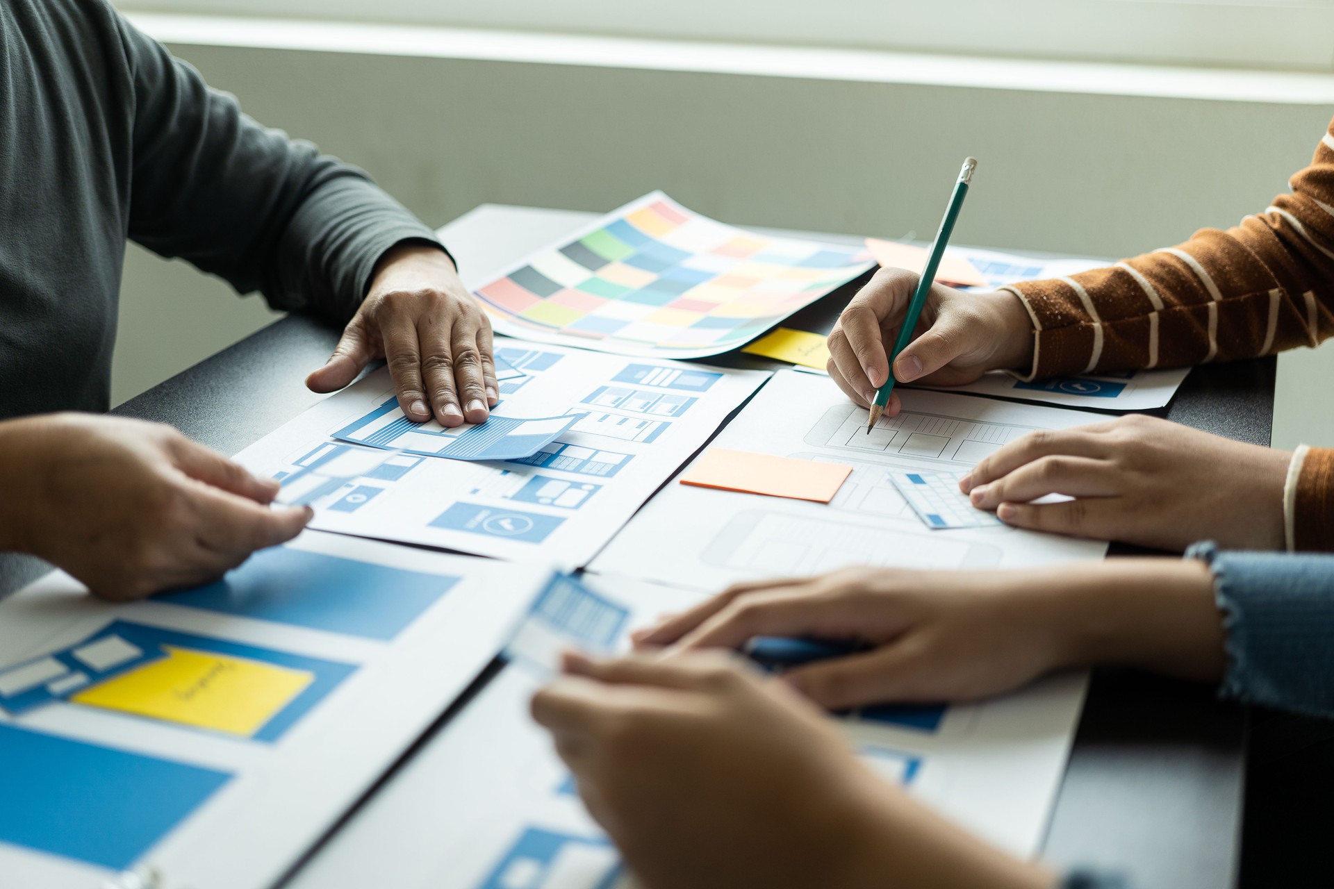 UI/UX web design teams are working together to develop mobile application websites too. 
Website development concept with UX UI display system on the front of smartphone